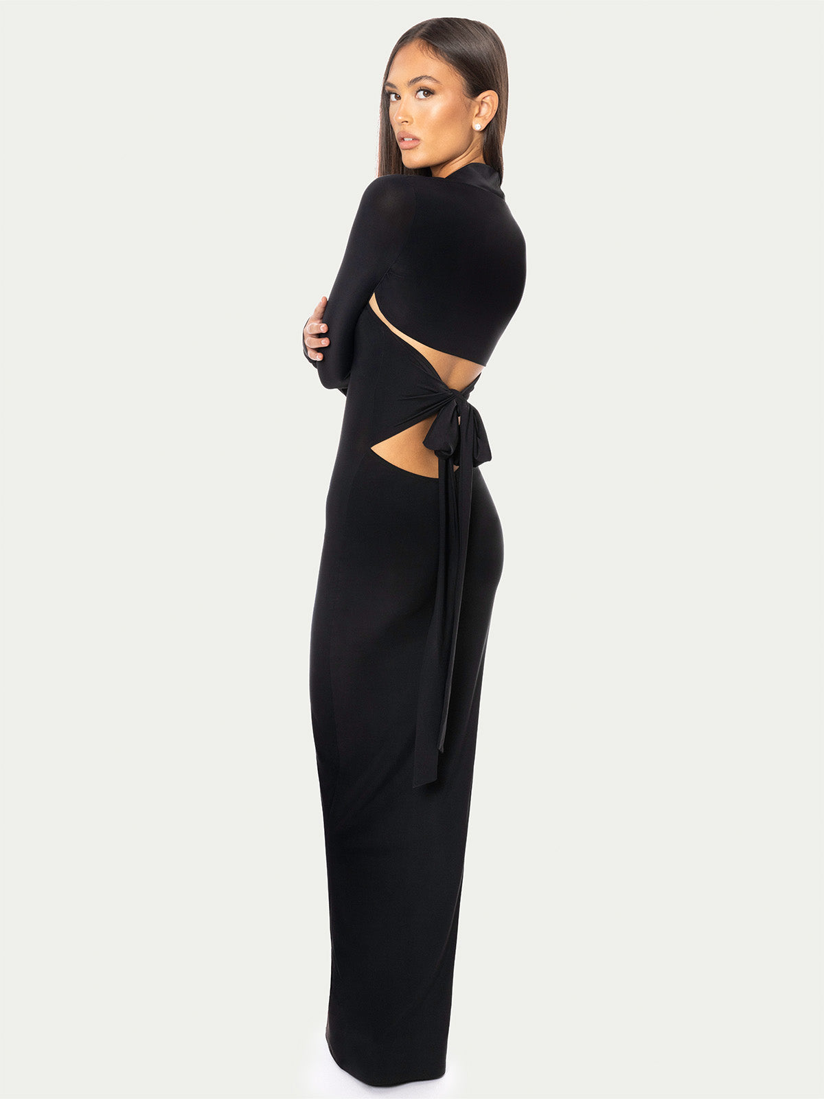 Black cropped bolero styled with sleek black maxi dress