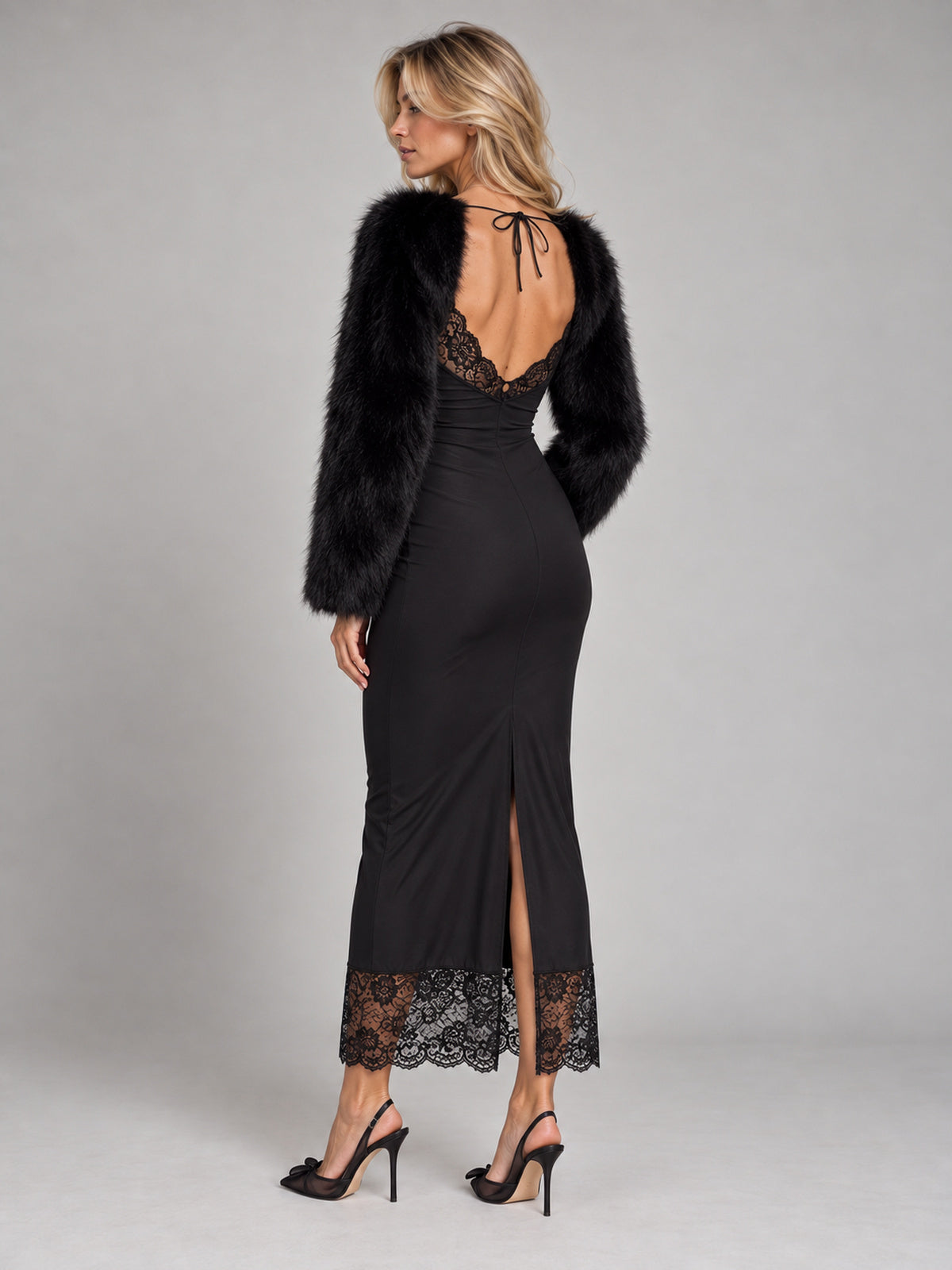 Svart faux fur-bolero över svart spetsklänning, bakifrån