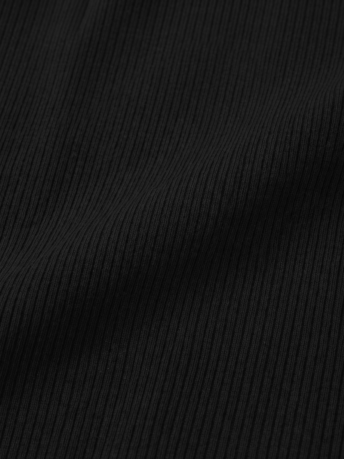 BREE black fabric swatch, close-up of the very fine vertical rib-knit texture and deep black color.
