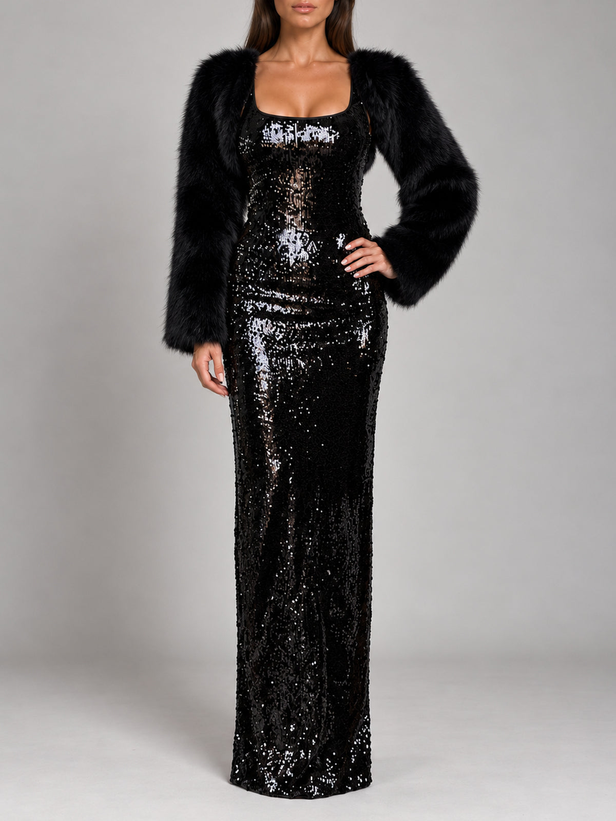 Cara Sequin black sequin maxi dress styled with a black faux fur bolero, front view