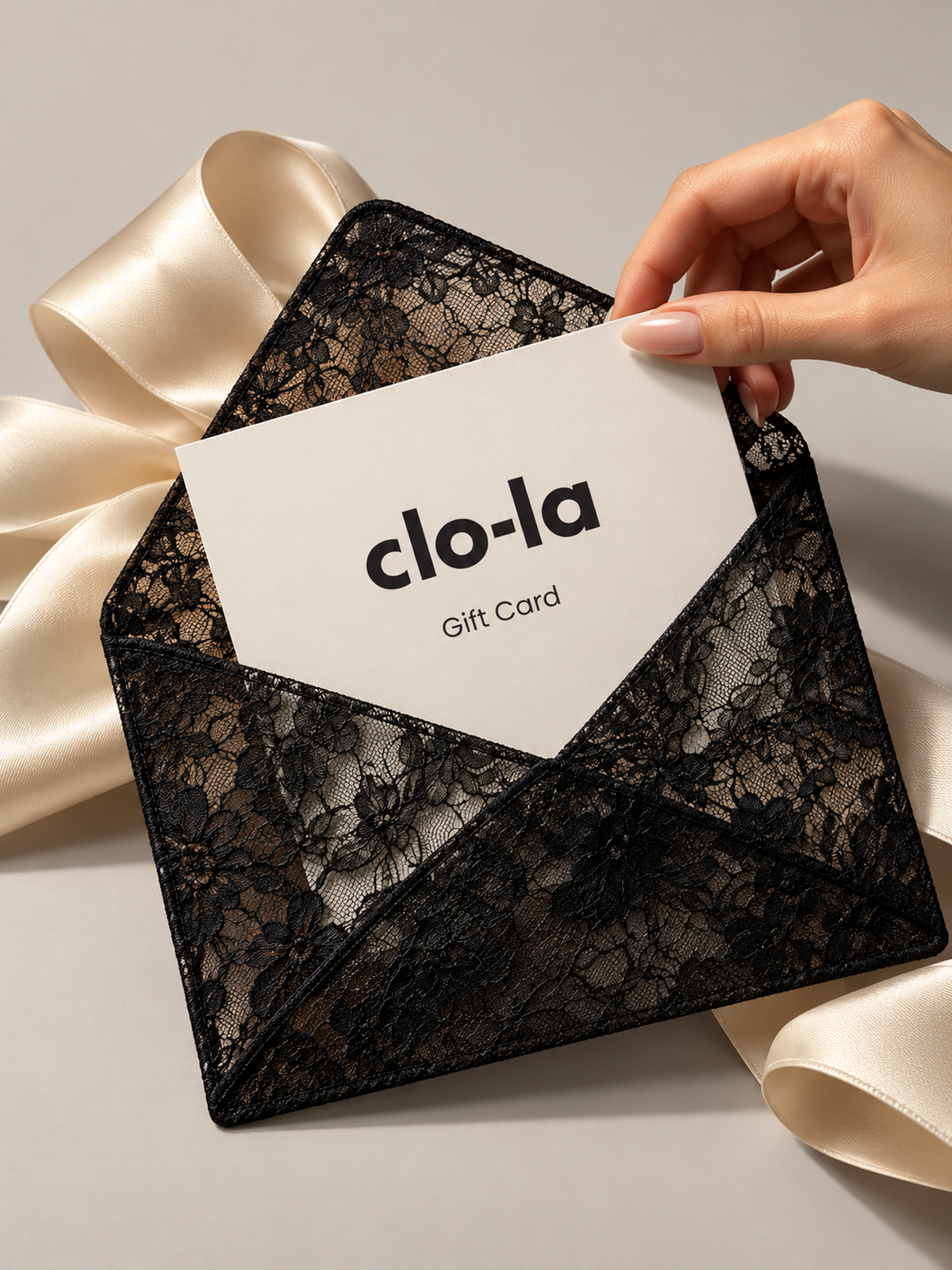 clo-la Gift Card in black lace envelope with ivory satin ribbon