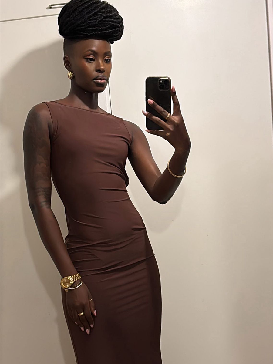 Brown maxi dress with sleek fit and minimalist styling detail