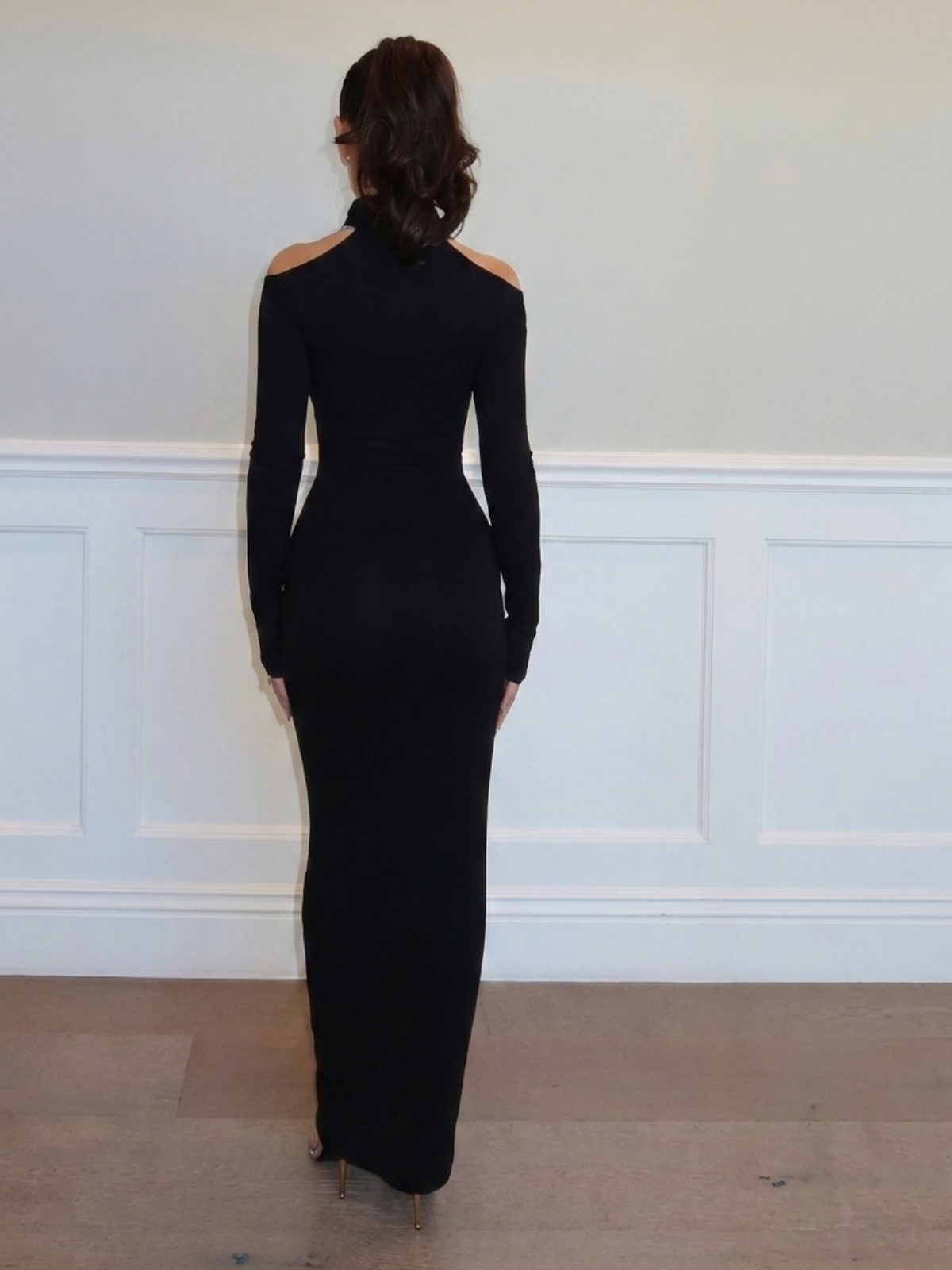 Black long sleeve maxi dress with fitted bodycon silhouette full length back view