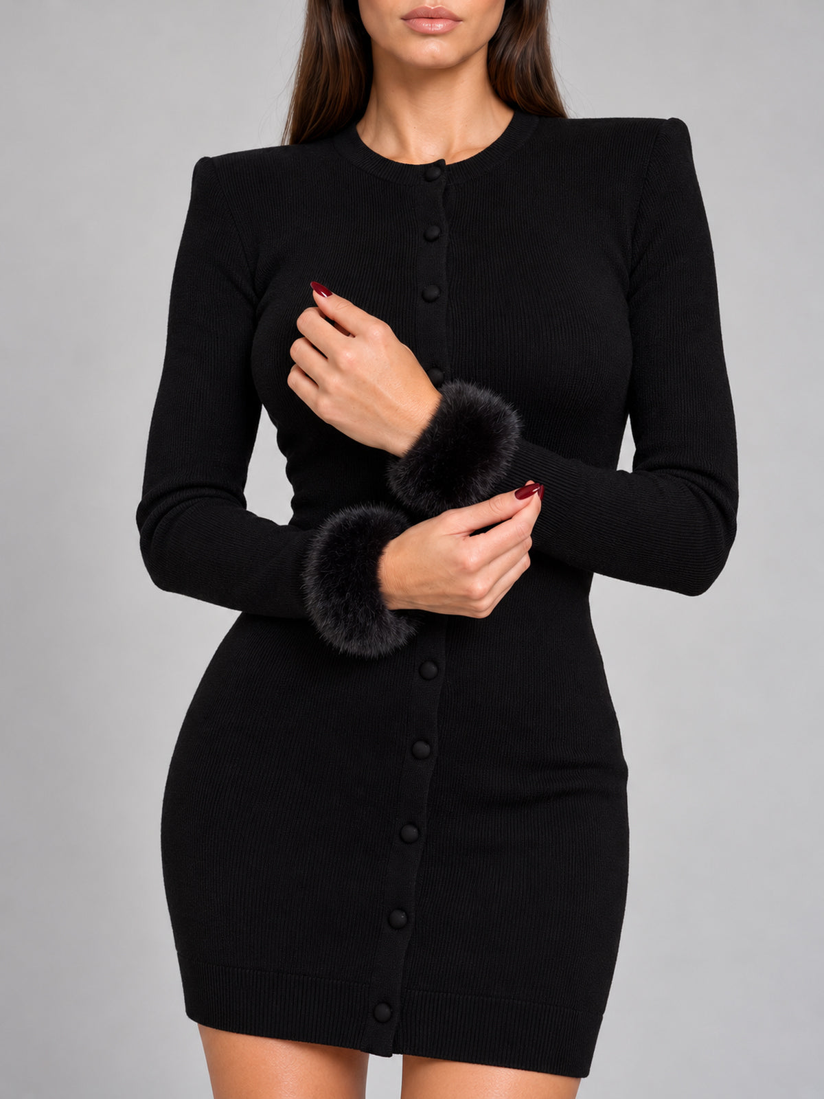HAILEY black fine-knit dress styled with faux-fur cuffs, sold separately.