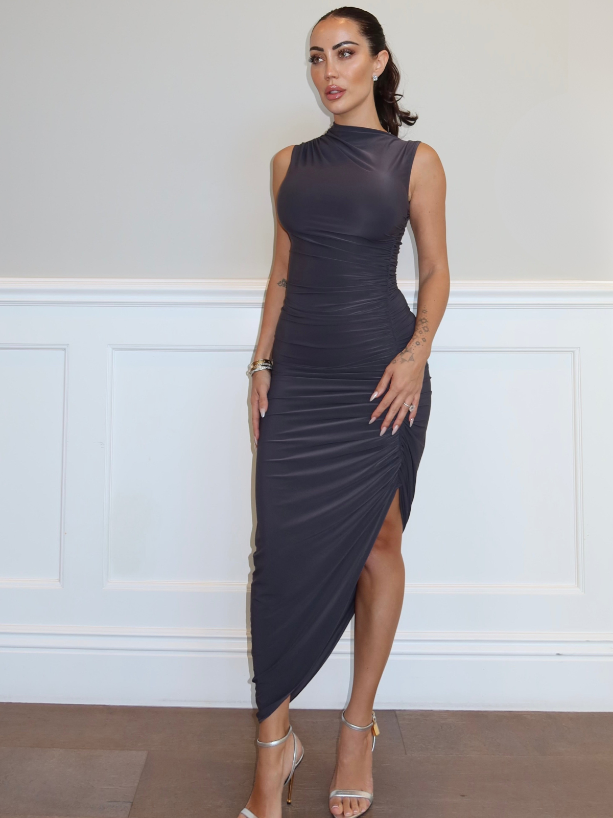 Warm grey asymmetrical midi dress with ruched detail and side slit, bodycon fit front view