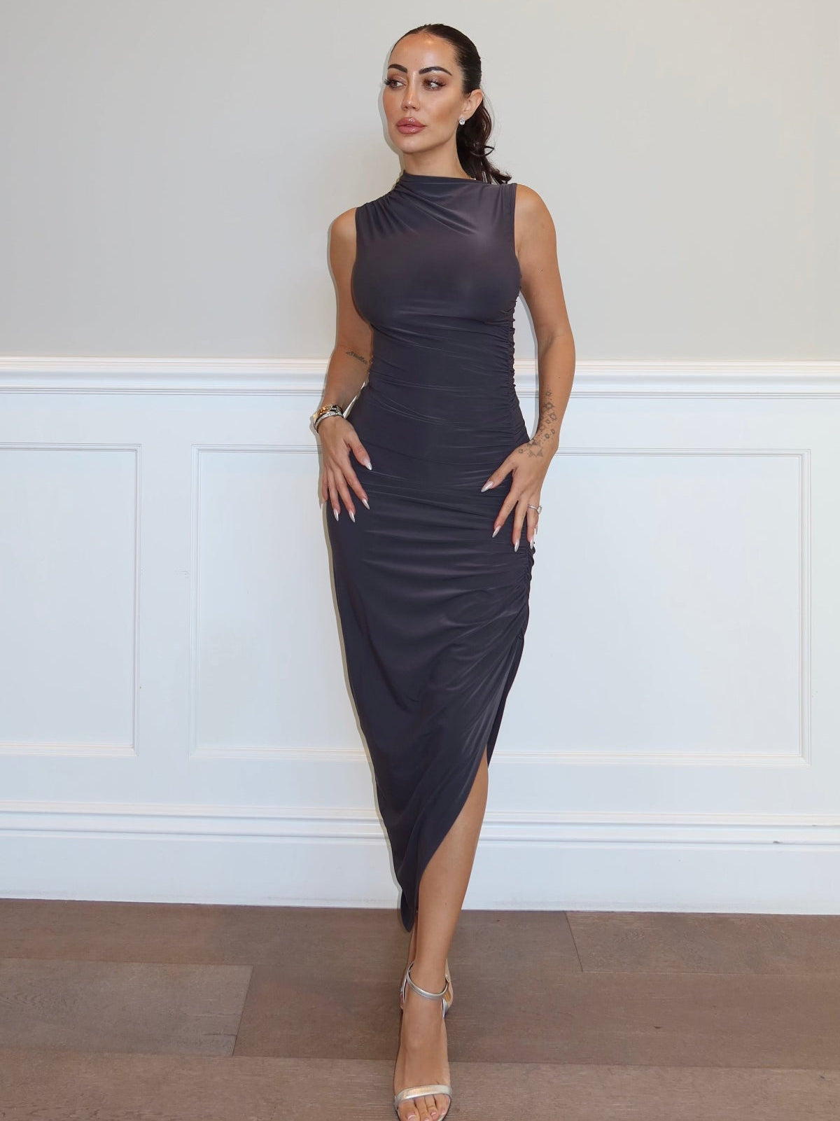Grey sleeveless maxi dress side view showing silhouette