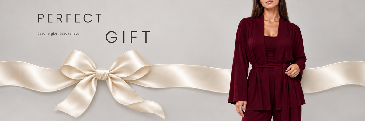 Perfect gift. Easy to give. Easy to love. Burgundy lounge pyjama set with an ivory satin ribbon.