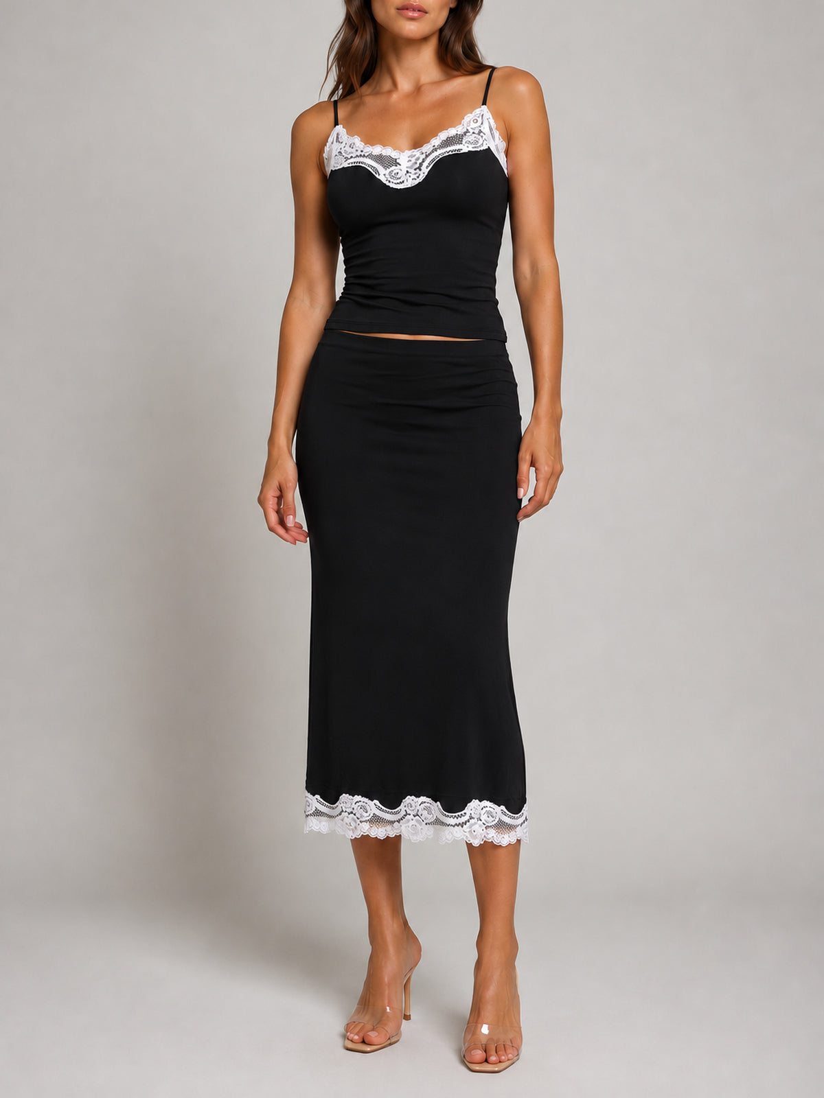 SUKI Black top and skirt with white lace, front view, faceless